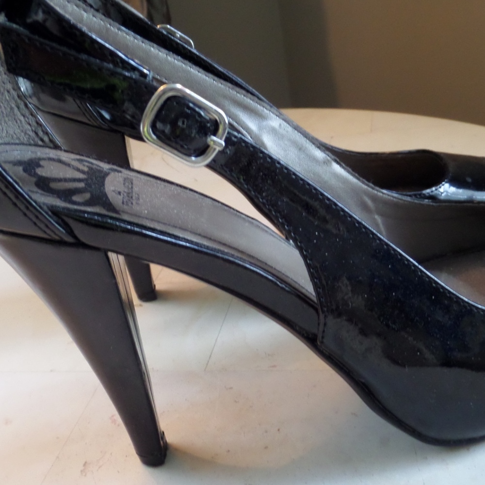 Fergie pumps! Black patent leather open side heels